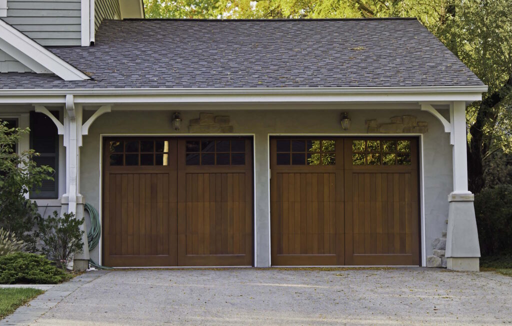2 single car faux-wood garage doors with windows