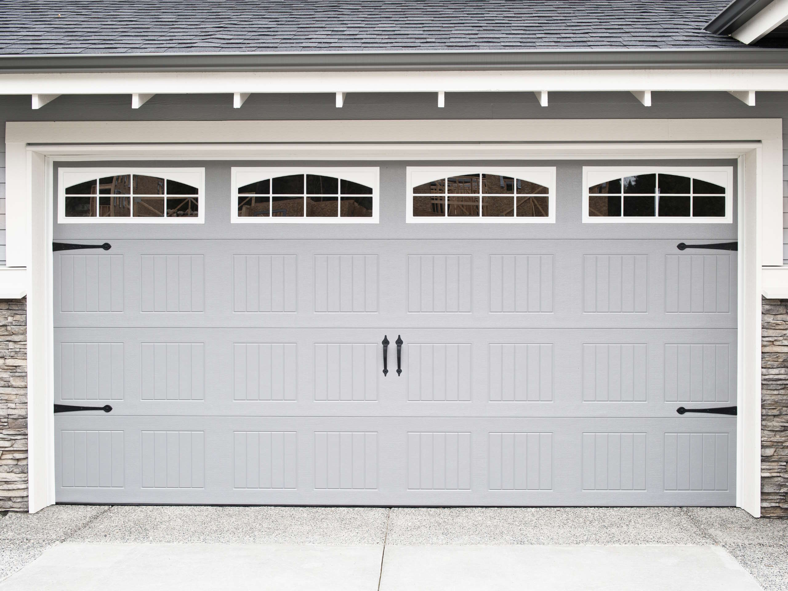 Grey bead board garage door with deco hinges